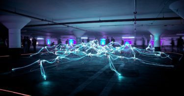 linked neon lights under white painted basement